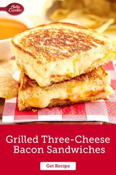 grilled three - cheese bacon sandwiches on a red and white checkered napkin