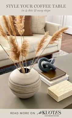 a coffee table with some plants and books on it