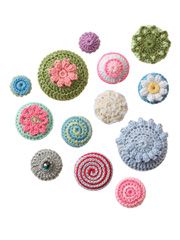 several crocheted objects are arranged in the shape of circles and spirals on a white background