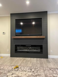 a flat screen tv mounted above a fireplace