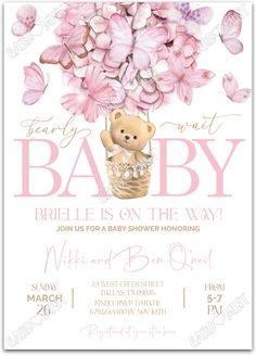 a baby shower with pink flowers and a teddy bear