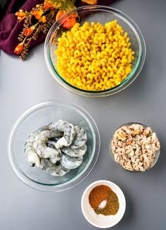 bowls filled with different types of food on top of a table