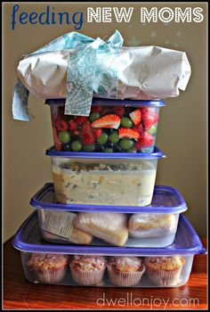 three plastic containers stacked on top of each other with food in them and the words feeding new moms below