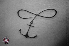 an anchor tattoo on the back of a woman's stomach, which is drawn in black ink