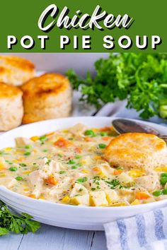 chicken pot pie soup in a white bowl with bread and parsley on the side