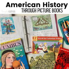 an open book with children's books and pencils next to it on a table