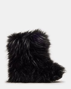 Introducing the BEASTIE bootie! Made with cozy faux fur, these boots will keep your feet warm while adding a touch of playfulness to your style. A must-have for the colder months! .5 inch heel height 17.5 inch shaft circumference 8.5 inch shaft height Faux fur upper material Faux fur lining Faux fur sock Synthetic sole Fit tip: If you are in between sizes, size up a half-size Imported Black Fur Boots, Women's Booties, Black Faux Fur, 5 Inch Heels, Spring Looks, Shoes Booties, Fun Bags, Bootie, Bootie Boots