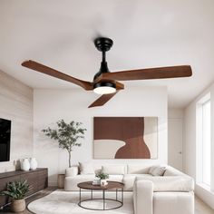 a living room with white furniture and a ceiling fan