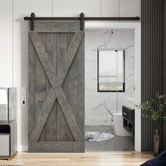 an open sliding door in a bathroom with wood flooring and white walls, along with a rug on the floor