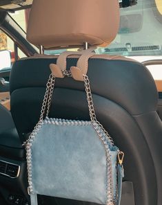 a purse is chained to the back of a car