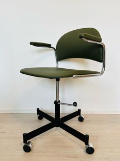 an office chair sitting on top of a hard wood floor