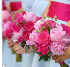 the bridesmaids are holding their pink bouquets