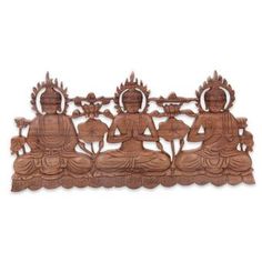 an intricate carved wooden panel depicting buddhas