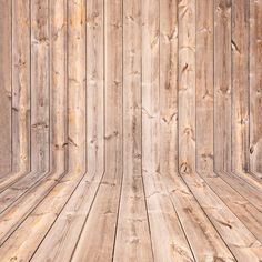 an empty room with wooden walls and flooring