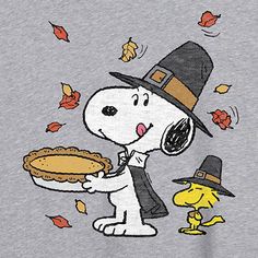 a cartoon dog holding a pie in his hand