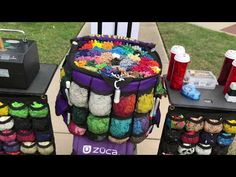 there are many crocheted items on display in the yard, and one is for sale