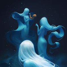 two mermaids are swimming in the water with their tails spread out and one is blowing bubbles