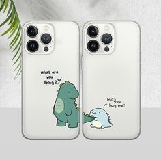 two phone cases with cartoon characters on them, one is holding the other's hand