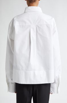 Forget business as usual. The classic poplin button-up gets a contemporary reboot in this slightly cropped, boxy rendition with an exaggerated collar and wide-set sleeves. 25" length (size 44 EU) Front button closure Spread collar Long sleeves with one-button cuffs Side slits 100% cotton Dry clean Made in Italy Designer Clothing Exaggerated Collar, Jil Sander, Cotton Poplin, Button Up Shirts, Designer Clothing, Button Up, Lab, Dry Clean, Nordstrom