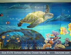 the mural on the wall depicts an ocean turtle and other marine life, including fish