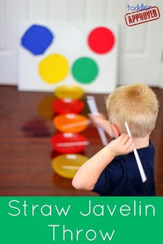 a young boy holding a toothbrush in front of a stack of colored circles with the words straw javelin throw