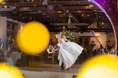 the bride and groom are dancing at their wedding reception