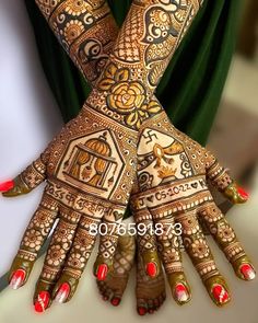 the hands are decorated with henna designs