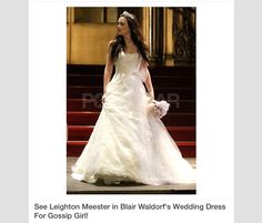 a woman in a wedding dress is walking down the stairs with a man behind her