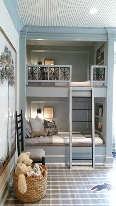 a bedroom with bunk beds and a teddy bear in the basket on the floor next to it