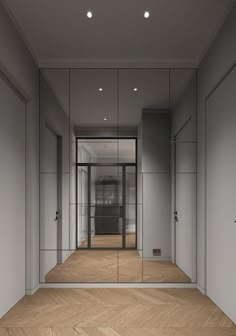 an empty room with mirrored doors and wooden flooring is pictured in this rendering image