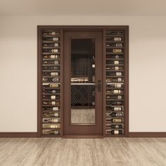 an empty room with wine bottles on the wall and wooden flooring in front of it