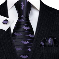 A Luxurious Addition To Any Outfit, This Purple And Black Bat Silk Necktie Set Is A Beautiful Finishing Touch Crafted With Italian Silk And Jacquard Weaving. The Vibrant Yet Subtle Purple And Black Bat Pattern Promises To Stand Out In Any Setting While The High-Quality Craftsmanship And 59-Inch Length Ensures A Perfect Fit. With A Complimentary Matching Pocket Square And Cufflinks Included, Make A Lasting Impression With This Elegant Set. Size 150cm = 59 Inch Long 8.5cm = 3.4 Inch Bottom Width. Package Comes With Full Size Necktie, Matching Pocket Square, Fabric Cufflinks, And Easy To Follow Written And Pictured Instructions On How To Tie The Classic Full Windsor Knot. Gothic Weddings, Men Suit Wedding, Scary Vampire, Halloween Themed Wedding, Bat Design, Purple Wedding Theme, Ties Mens Fashion, Dress Business, Purple Suits