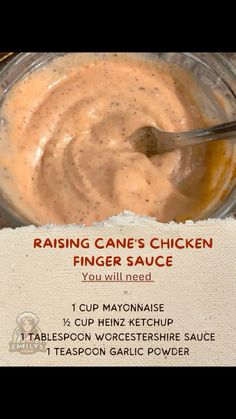 a spoon is in a glass bowl with some sauce on it and the words raising cane's chicken finger sauce you will need