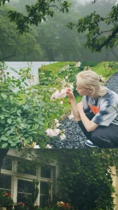 a woman kneeling down in front of a house with flowers growing on the side of it