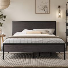 a bed sitting in a bedroom on top of a rug