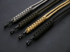 four black and gold arrows on a black leather surface