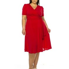 Product Description: Step into elegance with the Plus Size Stylish Solid Faux Wrap Dress featuring a Deep V-Neck. This chic and sophisticated dress is designed to flatter your curves while providing ultimate comfort. The faux wrap design creates a beautiful silhouette, and the deep V-neck adds a touch of allure. Crafted from high-quality, stretchable fabric, this dress is perfect for any occasion, from casual outings to formal events. Available in a range of solid colors, it's a versatile additi Red Fitted V-neck Short Sleeve Dress, Red Fitted V-neck Dress With Surplice Neckline, Red Knee-length V-neck Dress For Formal Occasions, Red V-neck Midi Dress, Red Fitted V-neck Dress With Short Sleeves, Elegant Red Short Sleeve V-neck Dress, Red Short Sleeve V-neck Dress, Chic Red Knee-length V-neck Dress, Red V-neck Short Sleeve Dress For Party