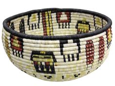 an african basket is shown with black trimming and multicolored designs on it