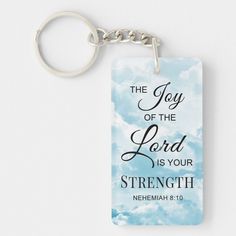 the joy of the lord is your strength keychain with bible verse on it