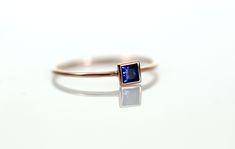 "14K GOLD BLUE SAPPHIRE SQUARE RING ◈ ITEM DETAILS * Gold - 14K Solid Gold (*Please contact us for the 18K gold) * Blue Sapphire - Natural / Non-treated / Grade \"AAA\"(High Quality) / Carat Weight : 0.17ct / 4mm X 4mm * Band - Width : 1.0mm / \"14K\" Stamped on the inside of the band / Glossy (Textured is also available) * Handmade * Made to Order * Ready to ship in 2 weeks ◈ BLUE SAPPHIRE SQUARE RING This square design ring is so special. The natural blue sapphire brilliantly shines. The heave Blue Square Cut Ring For Gift, Rectangular Blue Sapphire Ring In 14k Gold, Sapphire Ring Gold, Unique Gold Rings, Gemstone Jewellery Design, Gold Sapphire Ring, Ring Square, Gold Rings Simple, Blue Sapphire Ring