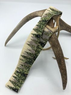 an antler's head is covered with fabric