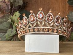 Beautiful, sparkles, good quality Tiara with big Rose Gold stones, with Crystal Rhinestone set on gold Tiara. Perfect for Prom, Birthday, Sweet 16, Quinceanera, Anniversary, Wedding, or for any other special occasion. Or just to be THE QUEEN. THE COLORS ON THE TIARA: Gold the tiara frame, Rose Gold and Crystal clear Rhinestone THE SIZE 2 tall on the front. 1.5" tall on the sides. GIFT BOX IT'S NOT INCLUDED! This item it will send on STANDARD FIRST CLASS MAIL (2 to 5 business days). in USA If you Rose Gold Quinceanera, Birthday Rose Gold, Birthday Sweet 16, Quinceanera Tiaras, Tiara Gold, Sweet 16 Themes, Rose Gold Tiara, Prom Birthday, Gold Tiara