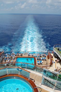 the deck of a cruise ship with a pool on it