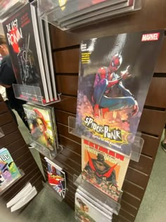 the spider - man movie poster is on display for people to see it in their store