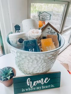 a white bowl filled with lots of different types of items on top of a table