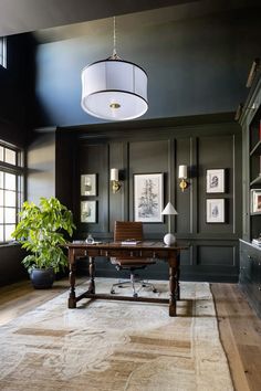 a living room filled with furniture and a large rug on top of a hard wood floor