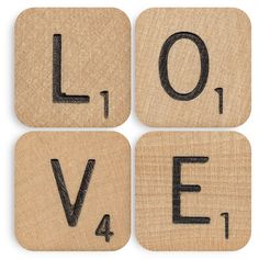 four wooden scrabbles with the word love spelled in black ink on them