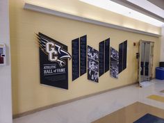 a hallway with several banners on the wall