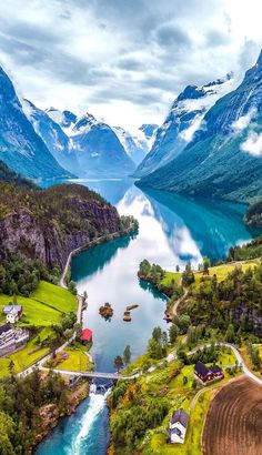 an aerial view of a river surrounded by mountains