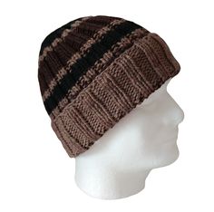 The chunky yarn and turned up brim on this hand knit hat will keep the wearer's ears toasty warm. The yarn is super soft merino and the colors are very masculine; dark brown and black set apart by light brown stripes. There is a resilience and bounce to wool fiber when you squeeze it that you get only with pure wool. And wool is best for keeping your head warm when those winter winds blow. This hat will stretch up to 23" and will fit an older boy or man with a smaller head. Item #591 - Chunky striped watch cap Fiber - Merino wool Color - Dark brown, light brown and black Size - Stretches to 23" around Care - Hand wash with cool water and mild soap (I use plain shampoo) Squeeze out water. Do not twist. Pat into shape and air dry flat. To see my other watch caps, click here: https://www.etsy Watch Cap, Hand Knit Hat, Black Set, Small Hands, Skull Cap Beanie, Chunky Yarn, Skull Cap, Merino Wool, Caps Hats